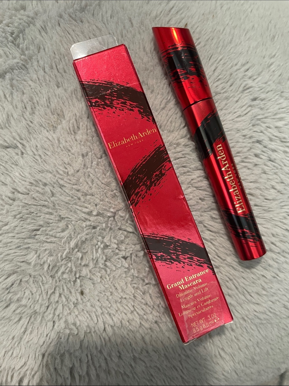 Elizabeth Arden Red Metallic Mascara Tube with Black Brushstroke Accents